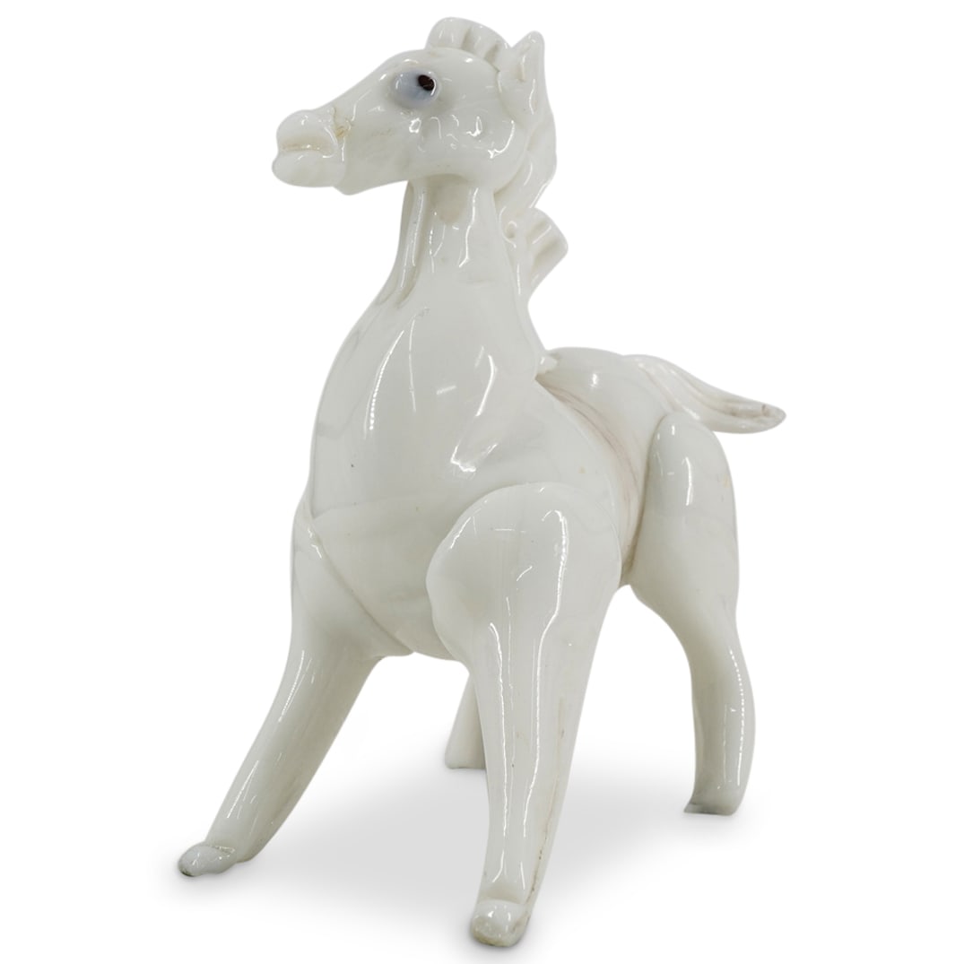 Murano Lattimo Glass Startled Horse: DESCRIPTION: Murano Lattimo glass sculpture in white depicting a startled horse taken aback. CIRCA: 20th Century ORIGIN: Italy DIMENSIONS: H: 8.75" W: 4" L: 7.75" CONDITION: Hind hooves appear to have