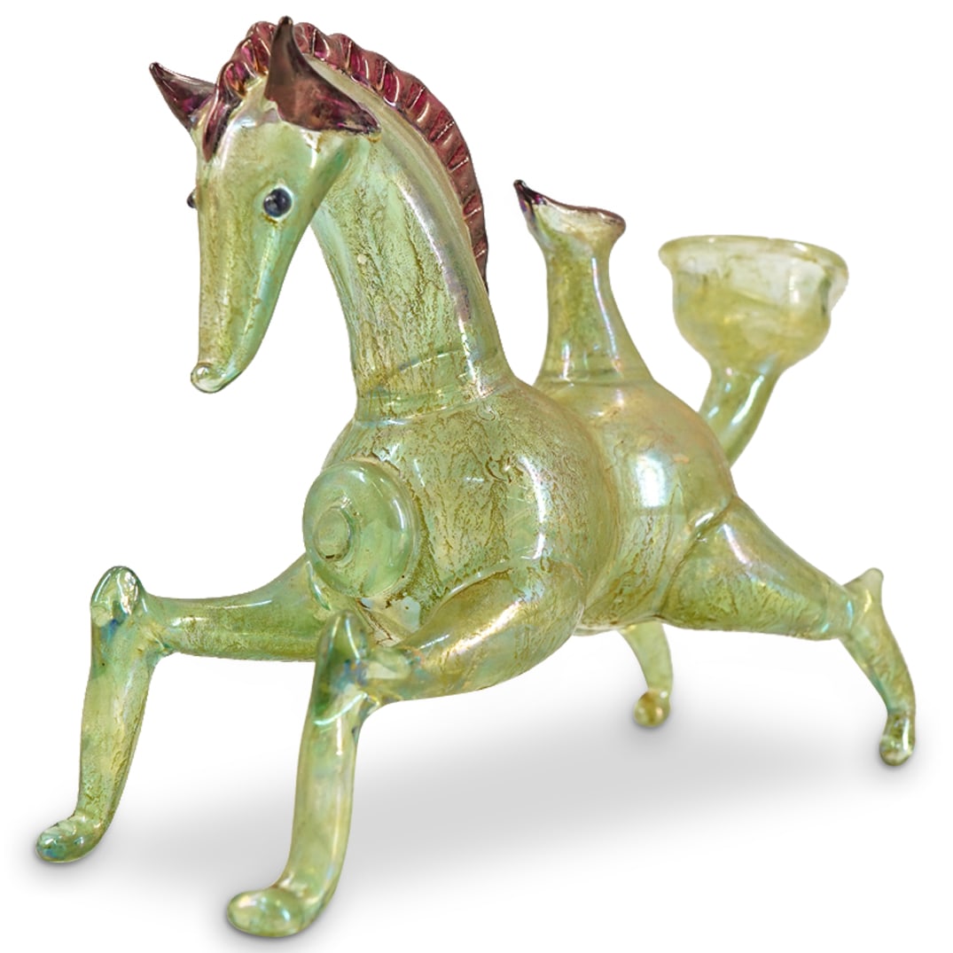 Etruscan Style Murano Blown Glass Horse Askos: DESCRIPTION: Etruscan style Murano glass askos in the form of a horse crafted from transparent green glass and accented with red-violet mane, eyes, ears, and spout lip. Unsigned. CIRCA: 20th Century O