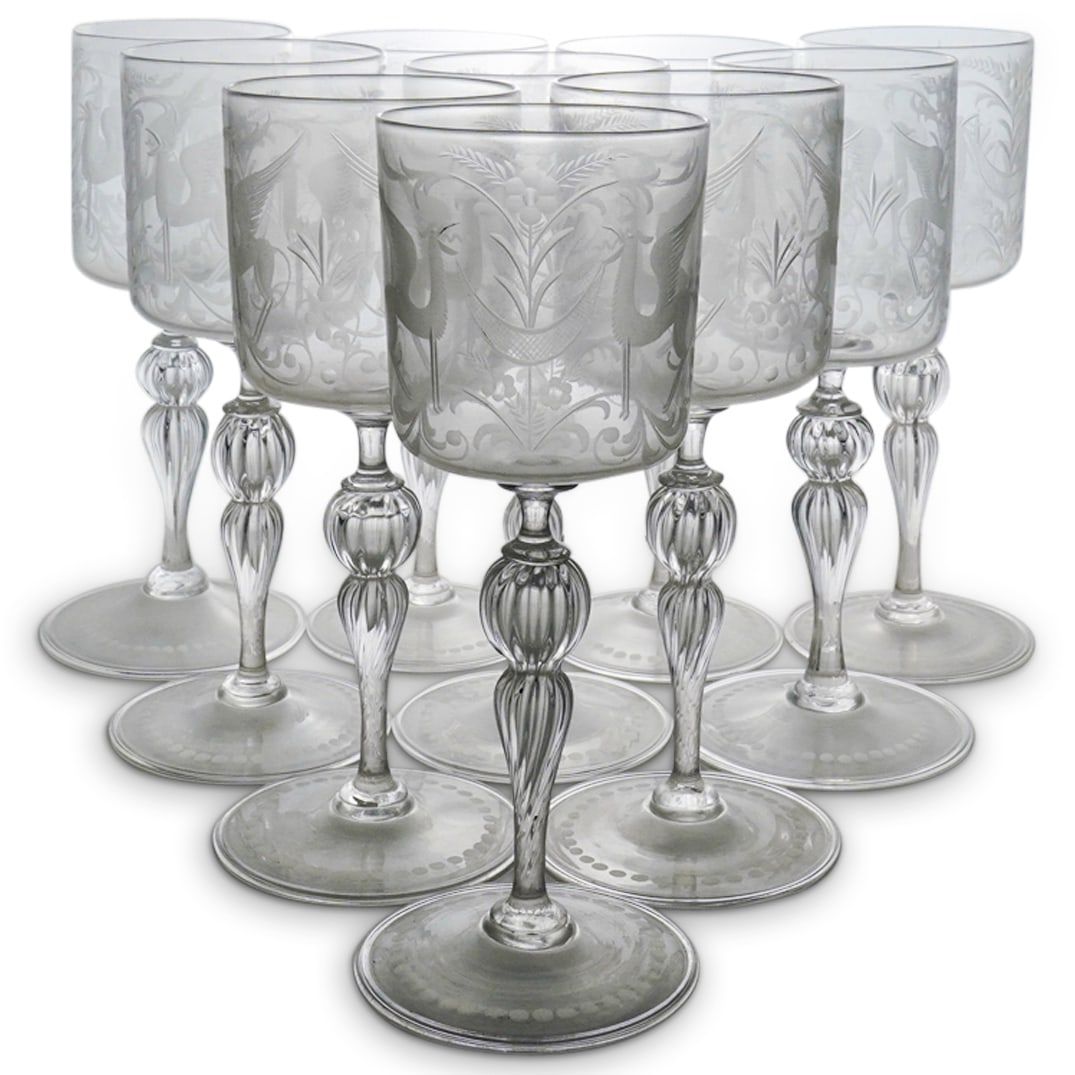 (10 Pc) Venetian Engraved Glass Wine Goblets Set: DESCRIPTION: (10 Pc) Venetian Engraved Etched Glass Wine Goblets Set. Decorated with etched winged dragon and floral decorative motifs. CIRCA: 20th Century ORIGIN: Italy DIMENSIONS: H: 7 7/8" CONDITIO