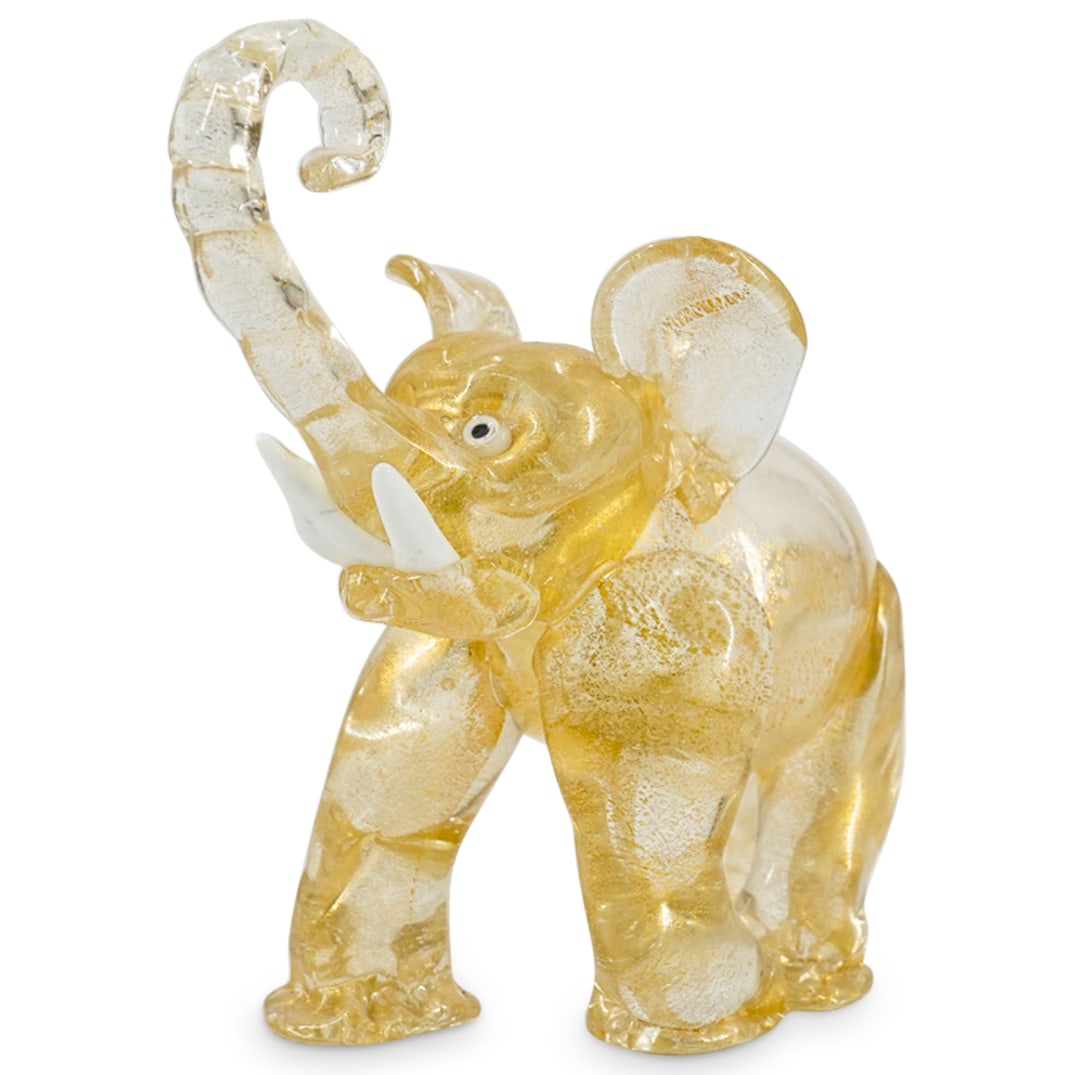 Murano Gold Flecked Colorless Glass Elephant Figure: DESCRIPTION: Murano Gold Flecked Colorless Glass Elephant Figurine. Depicts a walking elephant figure in clear glass with aventurine gold flecked accents, white tusks and white and black glass eyes. C