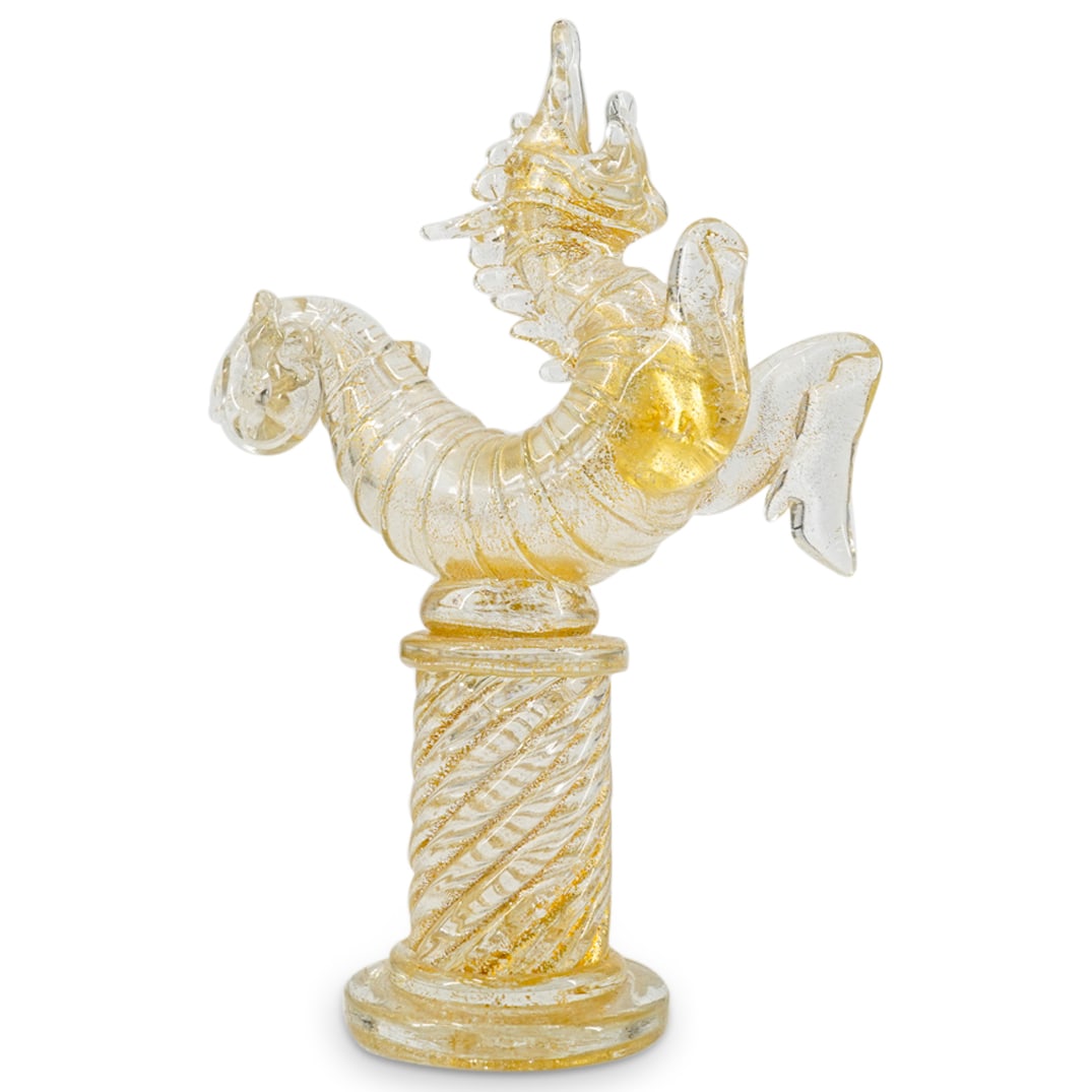 Murano Gold Flecked Colorless Glass Dragon Figurine: DESCRIPTION: Murano Gold Flecked Colorless Glass Dragon Figurine. Depicts a dragon atop a column base. CIRCA: 20th Century ORIGIN: Italy DIMENSIONS: H: 6 3/4" CONDITION: Damaged. Right frontal leg is 