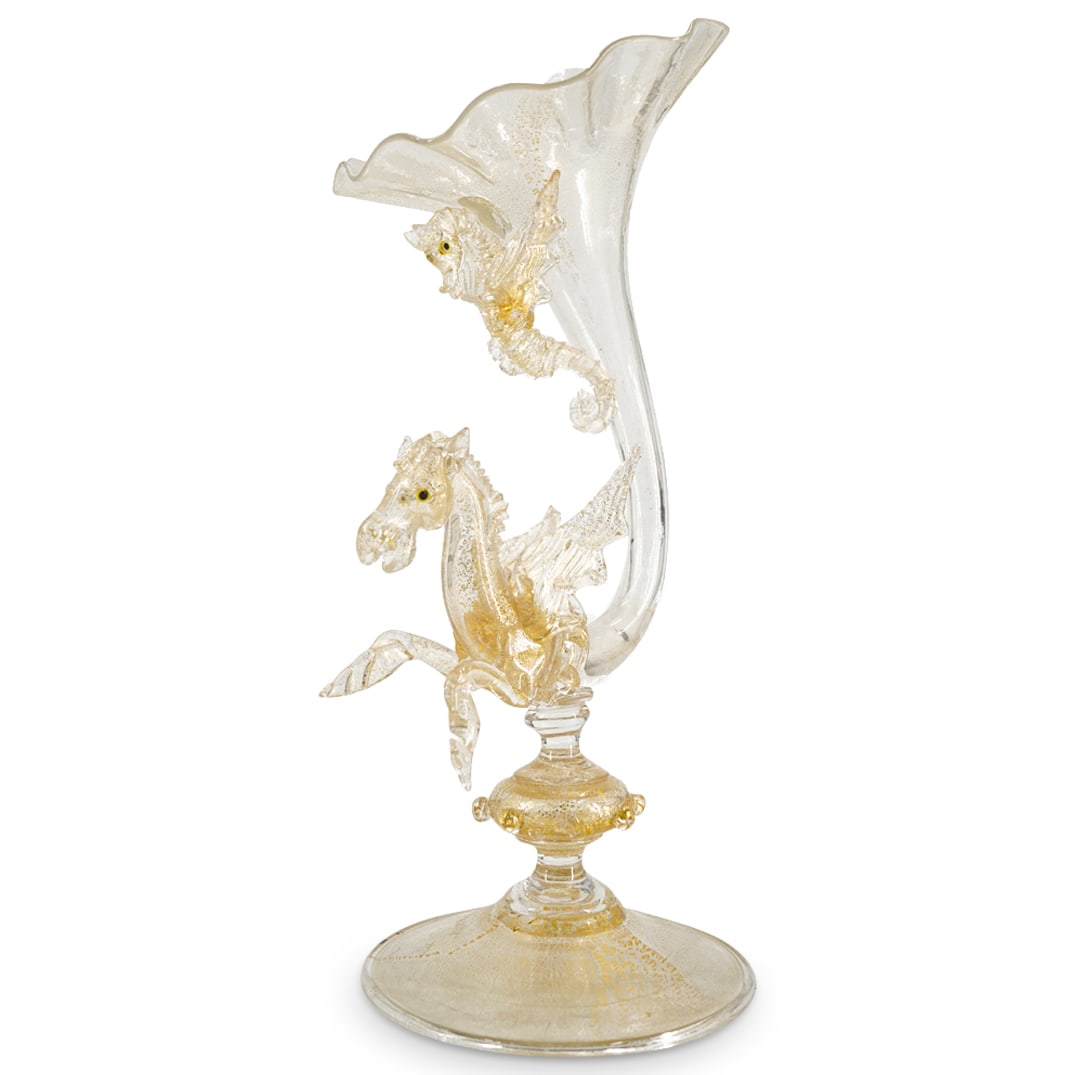 Salviati Blown Art Glass Bud Vase: DESCRIPTION: Salviati Blown Glass Bud Vase. Of flower form, in colorless glass, internally decorated with gold flecks, with a Pegasus stem, beneath a hovering winged seahorse, on a domed circular foot