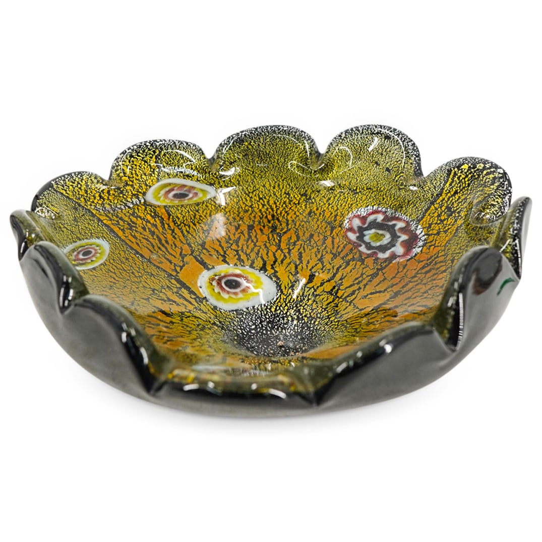 Murano Millefiori Glass Ashtray: DESCRIPTION: Murano glass ashtray internally decorated with millefiori and foil. Unsigned. CIRCA: 20th century or later ORIGIN: Italian DIMENSIONS: H: 2.75" W: 7.75" L: 8.25" CONDITION: Scratching to 