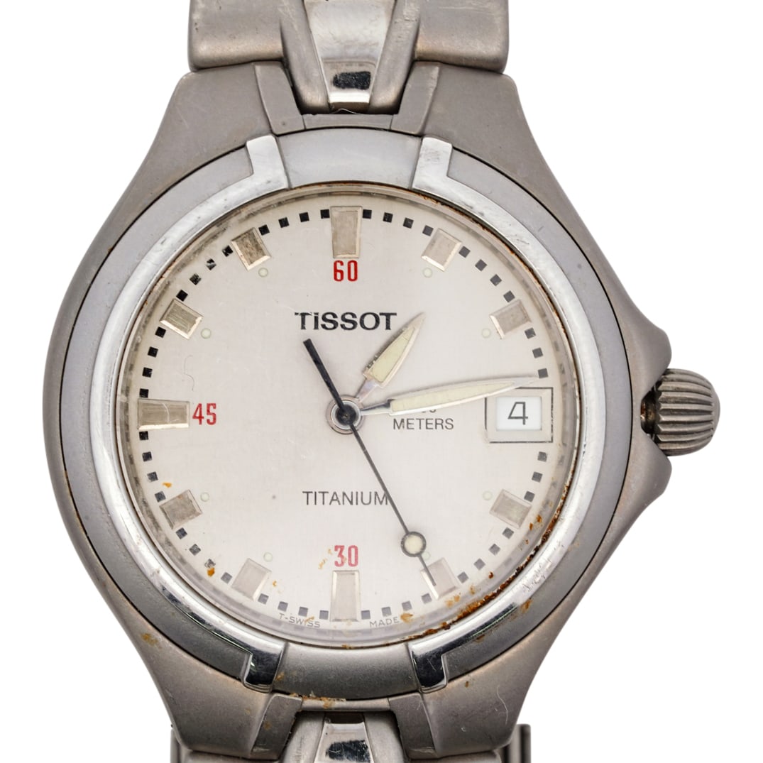 Tissot Titanium Quartz Watch: DESCRIPTION: Titanium, quartz, the wristwatch centering a circular silver-tone dial with silver-tone bar markers, sweep seconds, date aperture, diameter approximately 36 mm., completed by a fancy-shap