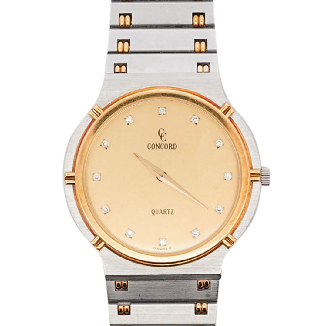 Concord 18k Gold and Stainless Steel "La Costa" Watch: DESCRIPTION: A Concord watch comprised of stainless steel case, gold dial, diamond markers with gold accented bracelet. Marked along the back "La Costa" "1581217v21" and "659798" CIRCA: 1990s ORIGIN: