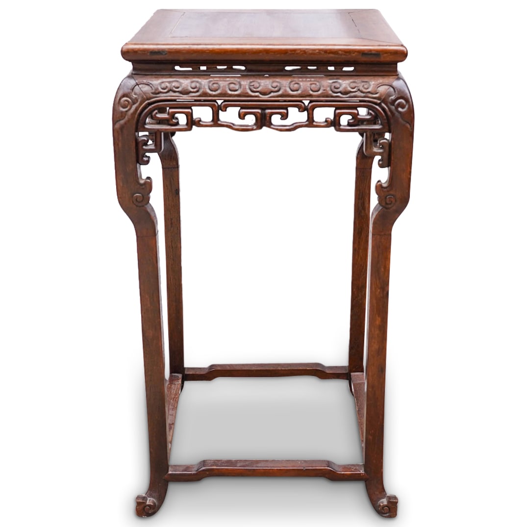 Antique Chinese Rosewood Pedestal: DESCRIPTION: Antique rosewood pedestal featuring open-work designs and yunleiwen (cloud thunder pattern) around the skirt. CIRCA: 19th to early 20th Century ORIGIN: China DIMENSIONS: H: 31.75" W: 17.7