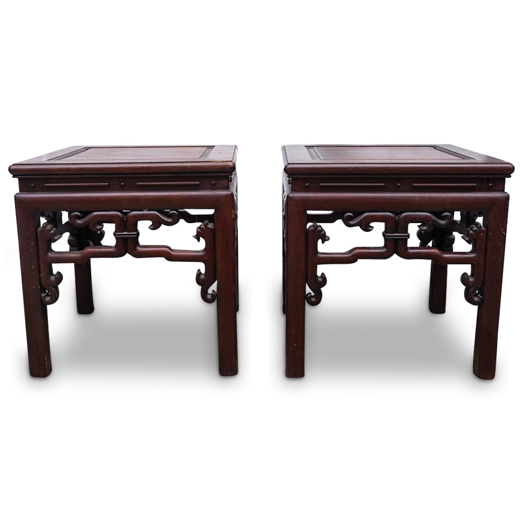Pair Of Antique Chinese Rosewood Pedestals: DESCRIPTION: Two matching antique rosewood pedestals, each featuring open-work designs around its skirt. CIRCA: 19th to early 20th Century ORIGIN: China DIMENSIONS: H: 16.25" W: 16" L: 16" CONDITION: 