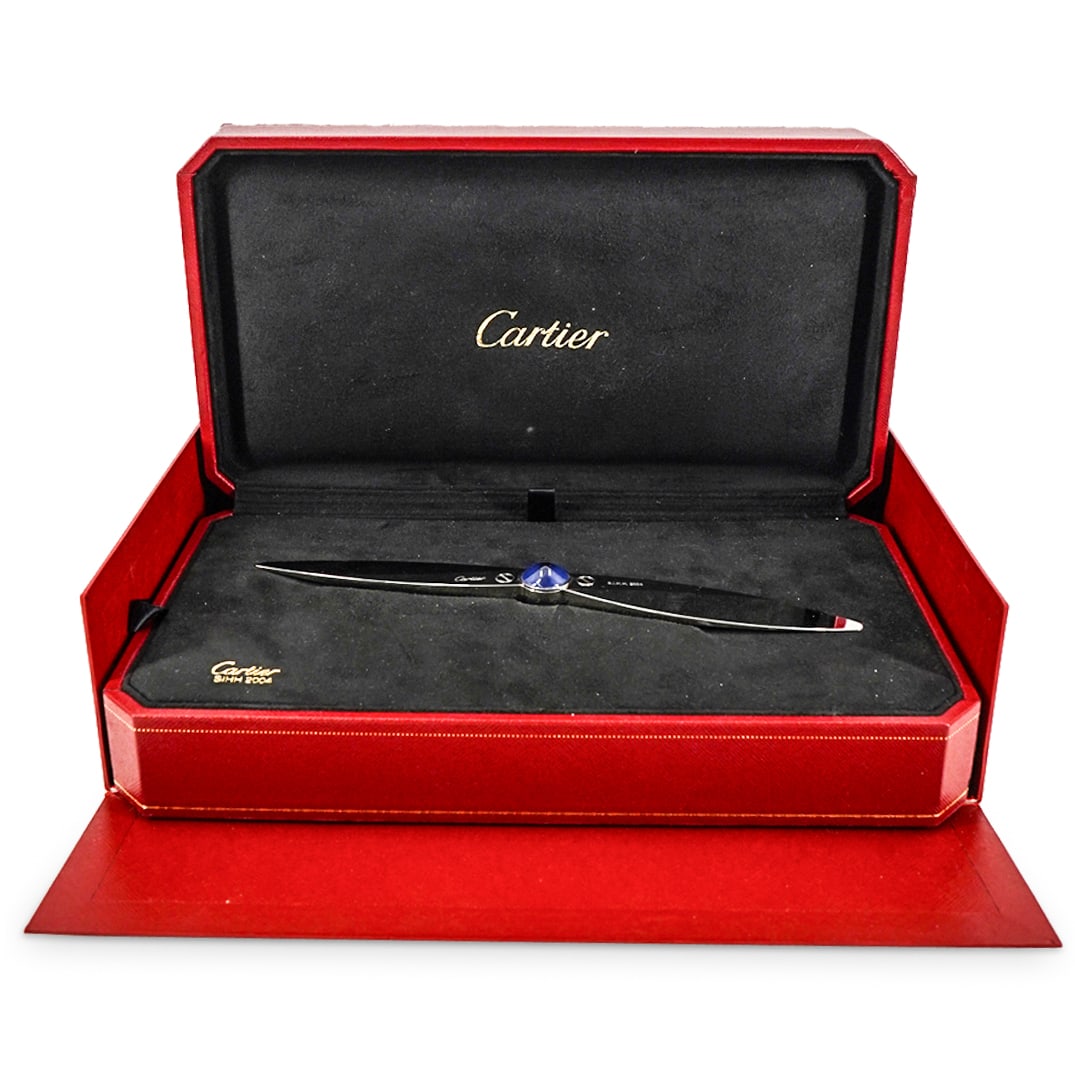 Cartier Paris Santos Letter Opener Paper Weight In Plated Stainless With Glass: DESCRIPTION: Cartier Paris Santos Letter Opener Paper Weight In Plated Stainless With Glass. Letter opener with a propeller shape, created in Paris France by the jewelry house of Cartier, back in the 
