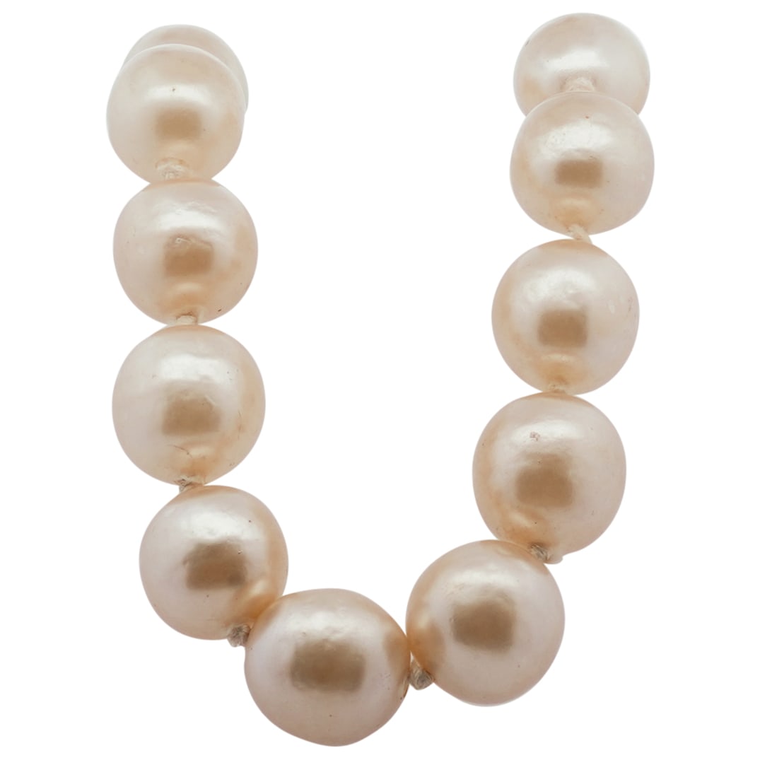 Vintage Chanel 1980s Faux Jumbo Pearl Necklace: DESCRIPTION: Vintage CHANEL 1980s Faux Jumbo Pearl Necklace. From the collection season 25. Marked with Chanel Made In France engraved logo. CIRCA: 1980s ORIGIN: France DIMENSIONS: L: 16 1/2" CONDITIO