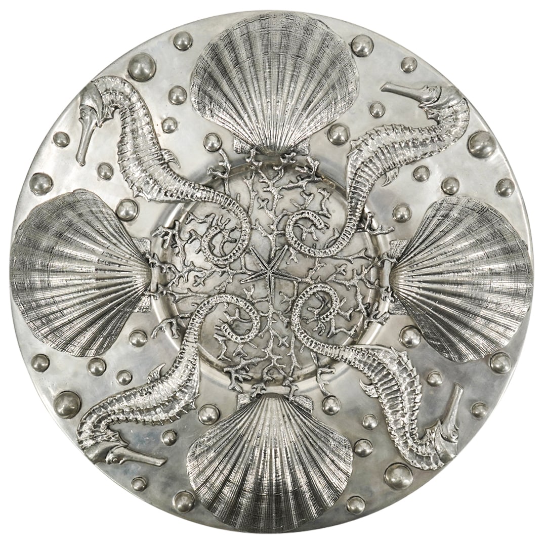 Piero Figura For Atena Pewter Charger: DESCRIPTION: Pewter charger by Piero Figura for Atena featuring marine motifs, including shells, seahorses, coral, and a starfish. Marked with "Figura Piero Per Atena Etain 95%" on underside. Componen