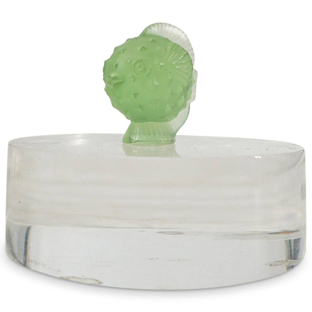 Lalique Crystal "Poisson Lune" Figurine Sculpture: DESCRIPTION: Lalique crystal "Poisson Lune" fish figurine sculpture. Depicts a small globular fish with a jaunty look, smooth skin, and spines. In light green glass color. Marked with "Lalique France"