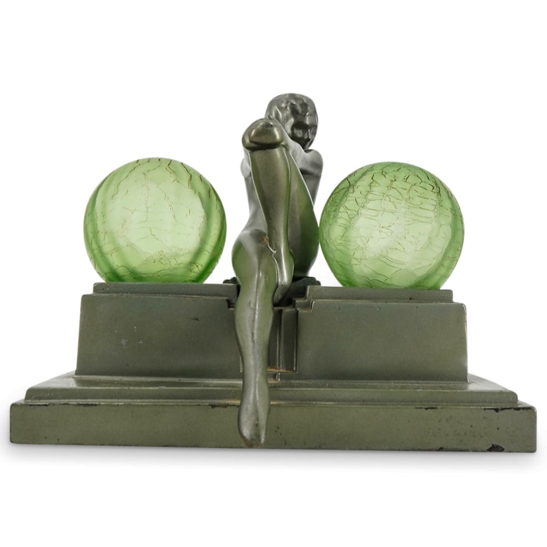 Art Deco Frankart Inc. Metal Figural Lamp: DESCRIPTION: Art Deco double socket table lamp by Frankart Inc. featuring a nude woman seated on a pedestal flanked by two green glass globe shades. Marked on verso to woman's left "Frankart Inc." Unt