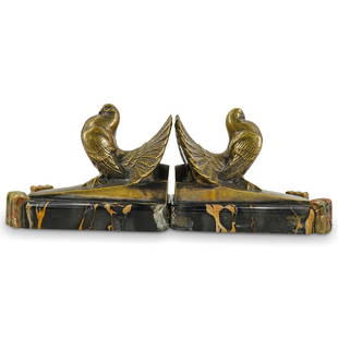 Pair Maurice Frecourt Bronze Pigeon Bookends: DESCRIPTION: Pair of Maurice Frecourt bookends, each composed of a bronze sculpture of a pigeon atop a slope mounted to a marble base with onyx ornaments. Marked with "Frecourt" at side of spelter. Br