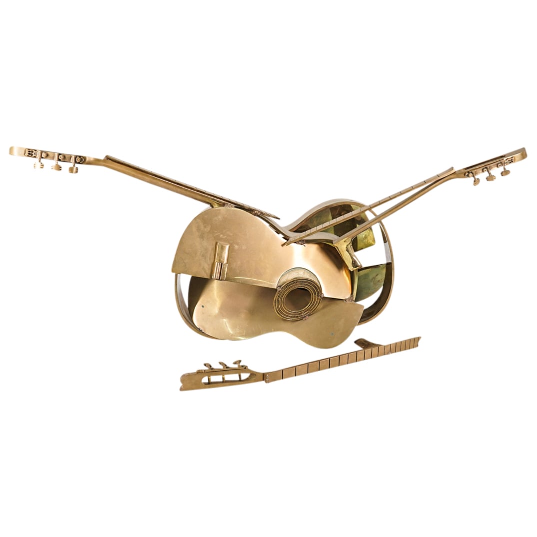 Fernandez Arman (French, 1928-2005) Gilt Bronze Guitars: DESCRIPTION: Gilt bronze sculpture by Fernandez Arman depicting two guitars in pieces melded together at various angles. CIRCA: 20th Century ORIGIN: France DIMENSIONS: H: 20" W: 14" L: 45" CONDITION: