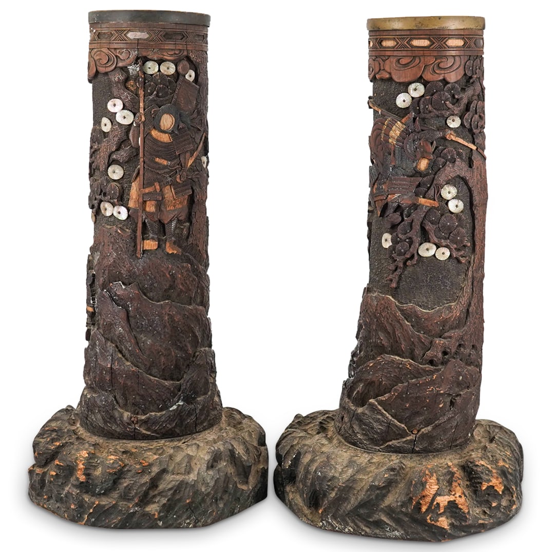 Pair Of Antique Japanese Meiji Shibayama Carved Wood Cylindrical Vases: DESCRIPTION: Two matching Meiji era cylindrical vases featuring shibayama scenes depicting reliefs of carved bone and wood warriors in combat among pine trees sporting mother-of-pearl needle clusters.