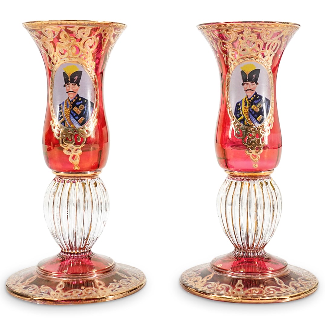 Pair Of Bohemian For Persian Market Ruby Glass Cordials: DESCRIPTION: Two matching ruby glass cordials, each featuring a portrait of Naser al-Din Shah Qajar in a gilt foliage border. CIRCA: 20th Century ORIGIN: Czechoslovakia DIMENSIONS: H: 5.5" L: 3" CONDI