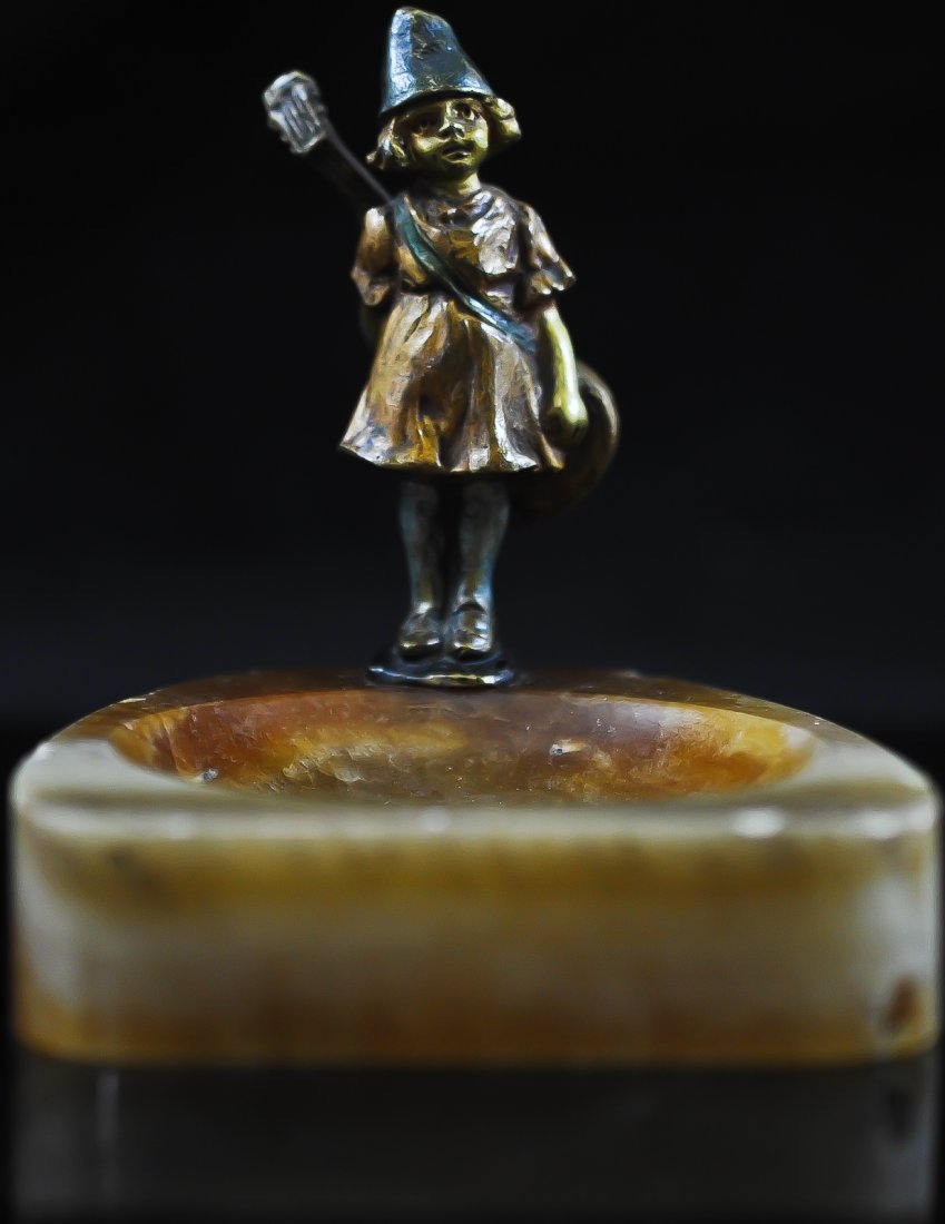 Austrian polychrome bronze girl figure on marble ba: DESCRIPTION: Austrian polychrome bronze girl mounted on marble base. She stands shy with a string instrument against her back. All original and a rare find. Signed "Austria" on back CIRCA: 1890's-1910