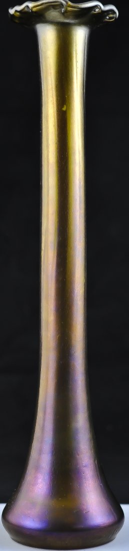Antique Loetz style iridescent flower vase: DESCRIPTION: Loetz style hand blown iridescent flower vase. Tall and thin usually used for a single rose. The glass is of a dark marigold yellow towards the top and blends into a fine burgundy towards