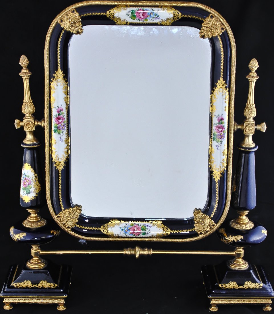 Large Sevres porcelain mirror. Signed in six place: DESCRIPTION: Large hand painted Sevres porcelain mirror. Gold outlined floral motif plaques. Each flower scene is signed. Three of the six flower plaques are by the same artist. The other three are si