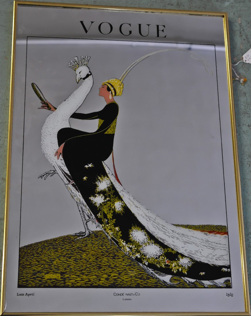 Vintage painted wall mirror by Vogue: DESCRIPTION: Vintage wall mirror with painting of a woman riding a pheasant. Vogue in large black letters towards the top. "Late April" and Conde Nast & Co London" towards the bottom CIRCA: 1970's-199