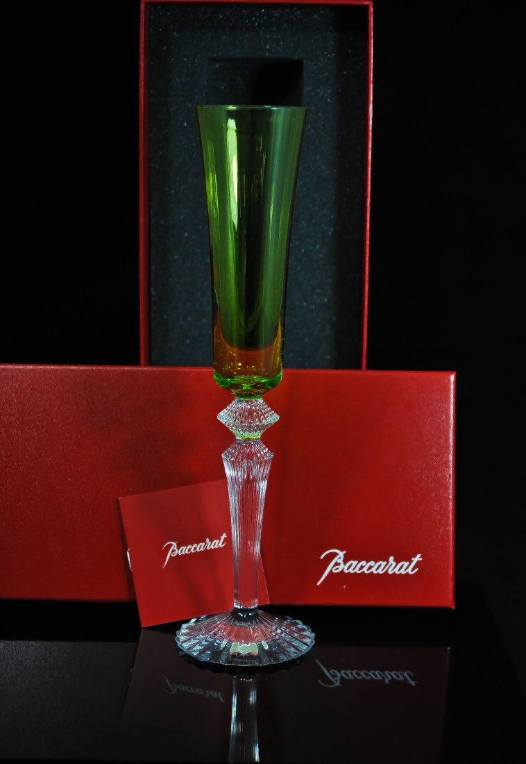Baccarat crystal champagne flute by Mathias: DESCRIPTION: Limited edition Baccarat (Lime green) colored crystal champagne flute by famous designer Mathias, footed on a clear cut crystal steam. Never used and comes in original Baccarat box. Hallm