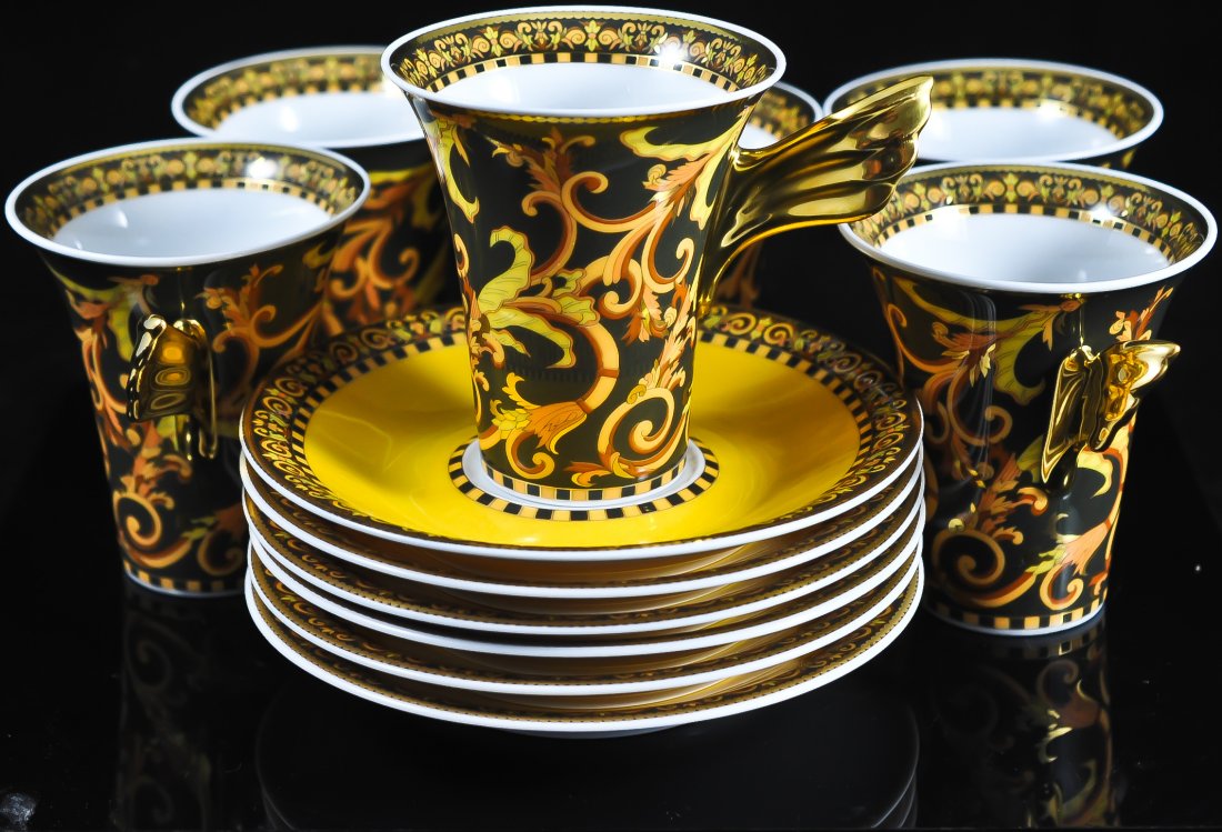 Set of 6 Rosenthal tea cups and saucers by Versace: DESCRIPTION: Set of 6 "Barocco" Rosenthal tea cups and saucers by famous Italian designer Versace. Saucers measure (H: 1" L: 5.75") Cups measure ( H: 3.50" L: 3.25") CIRCA: Late 20th Century MADE IN: