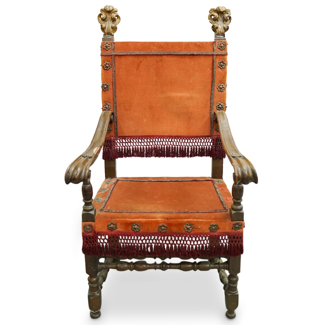 Antique Renaissance Revival Armchair: DESCRIPTION: Antique Renaissance Revival armchair featuring scrolled arms, turned stretcher bars, metal fittings, and (possibly later) acanthus-form ornaments at top. CIRCA: Mid - late 19th century OR