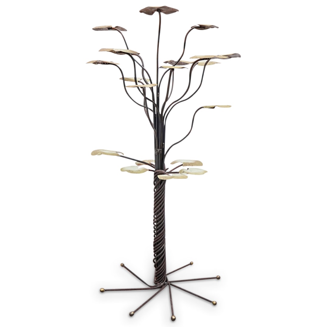Mid Century French Lily Pad Garden Sculpture: DESCRIPTION: Mid-century modern garden sculpture composed of wrought iron and fashioned as a series of lily pads extending from their coiled tendrils around a central column. CIRCA: Mid-20th Century O