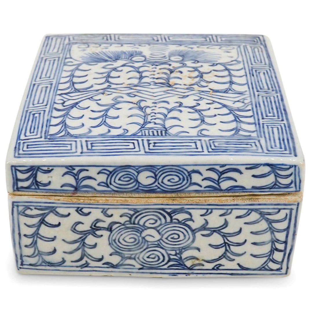 Vintage Southeast Asian Blue And White Porcelain Box: DESCRIPTION: Vintage blue and white porcelain box featuring foliage motifs and patterns throughout and yunwen (cloud patterns) around the lid. CIRCA: Mid-20th Century ORIGIN: Southeast Asia DIMENSIONS