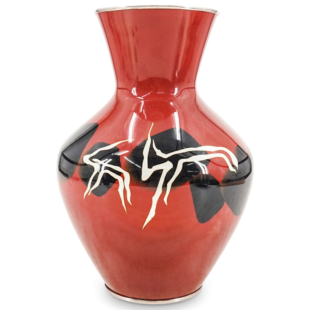 Japanese Ando Cloisonne Enamel Vase: DESCRIPTION: Japanese Ando cloisonne enamel vase features in a dark red ground color, decorated with white and and black animal motifs and completed with silver trims along the rim and base. Stamped w