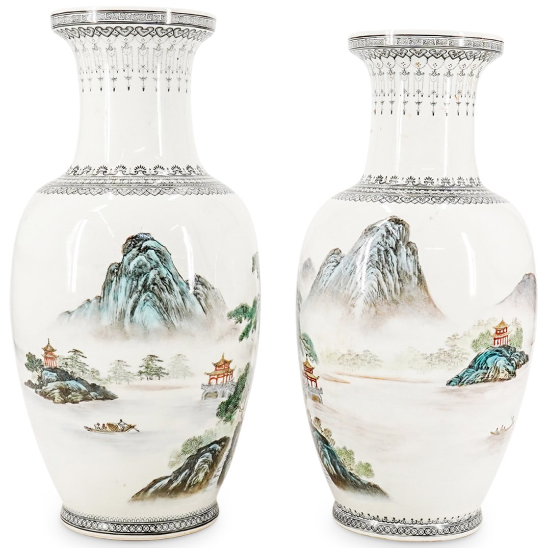 Pair Of Chinese Famille Porcelain Vases: DESCRIPTION: (2 Pc) Pair of Chinese porcelain vases in white glazed porcelain decorated with village and mountain scenes and inscribed with calligraphy and reign stamps. Stamped along the underside wi