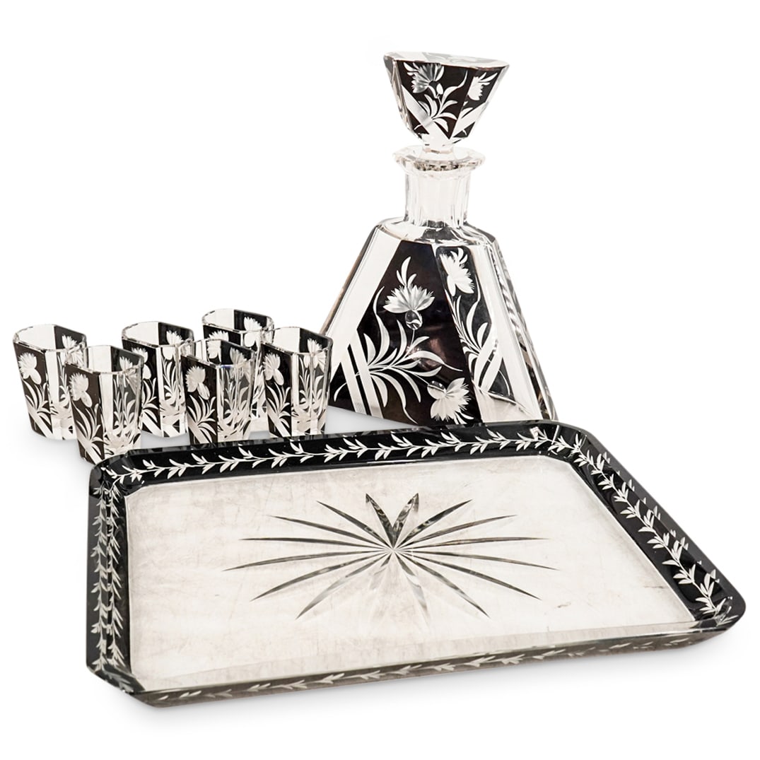 Karl Prada Art Deco Enamel and Etched Decanter Set: DESCRIPTION: Art deco enamel and etched decanter set with decanter and (6) cordial/shot glasses as well as a matching tray. All black enameled and heavy etched flowers. CIRCA: 1920-1930 ORIGIN: France