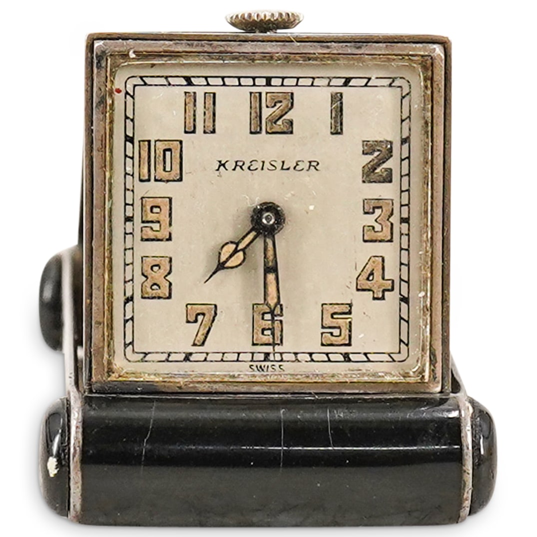 A Kreisler Art Deco Travel Clock/Purse Watch: DESCRIPTION: A Kreisler art deco travel clock/purse watch with gold inlay and black enamel. Marked "Kreisler Swiss:. CIRCA: 1920 ORIGIN: Switzerland DIMENSIONS: H: 1.5 W: 1: D: .25" CONDITION: Excelle
