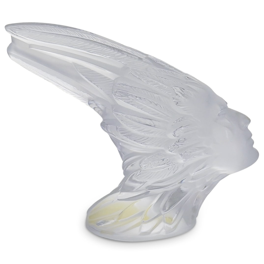 Lalique Crystal "Phenix" Figurine Paperweight: DESCRIPTION: Lalique Crystal "Phenix" Figurine Paperweight. Depicts a stylized male head with feather head-dress crafted in etched and polished clear crystal. Marked with Lalique France etched signatu