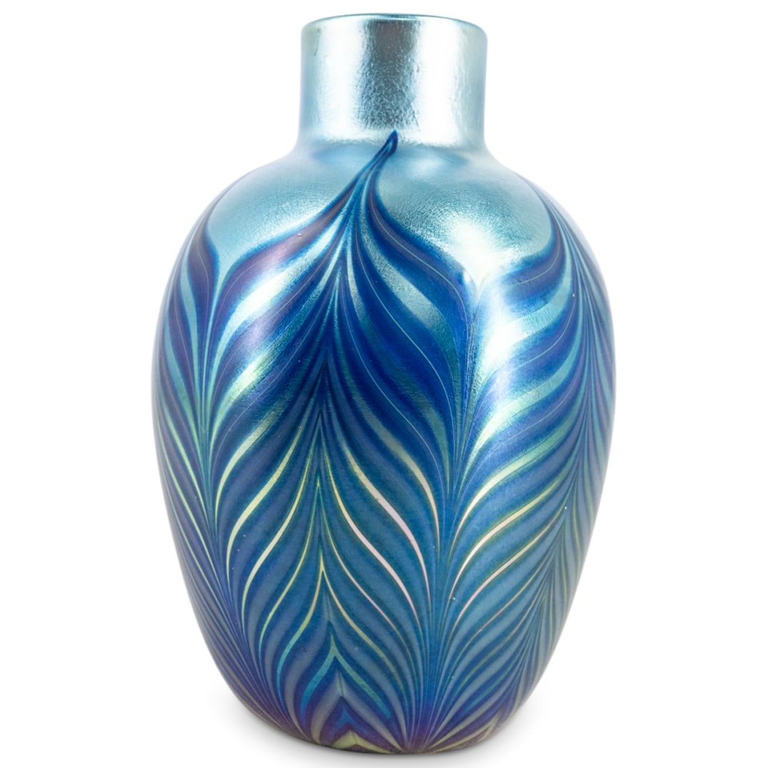 Orient & Flume Art Glass Vase: DESCRIPTION: Orient & Flume art glass vase with blue feathered silver iridescent design. Icised: "Orient & Flume, 1976 May, 117" CIRCA: 1976 ORIGIN: USA DIMENSIONS: H: 7.5" x D: 4.5" CONDITION: Great 