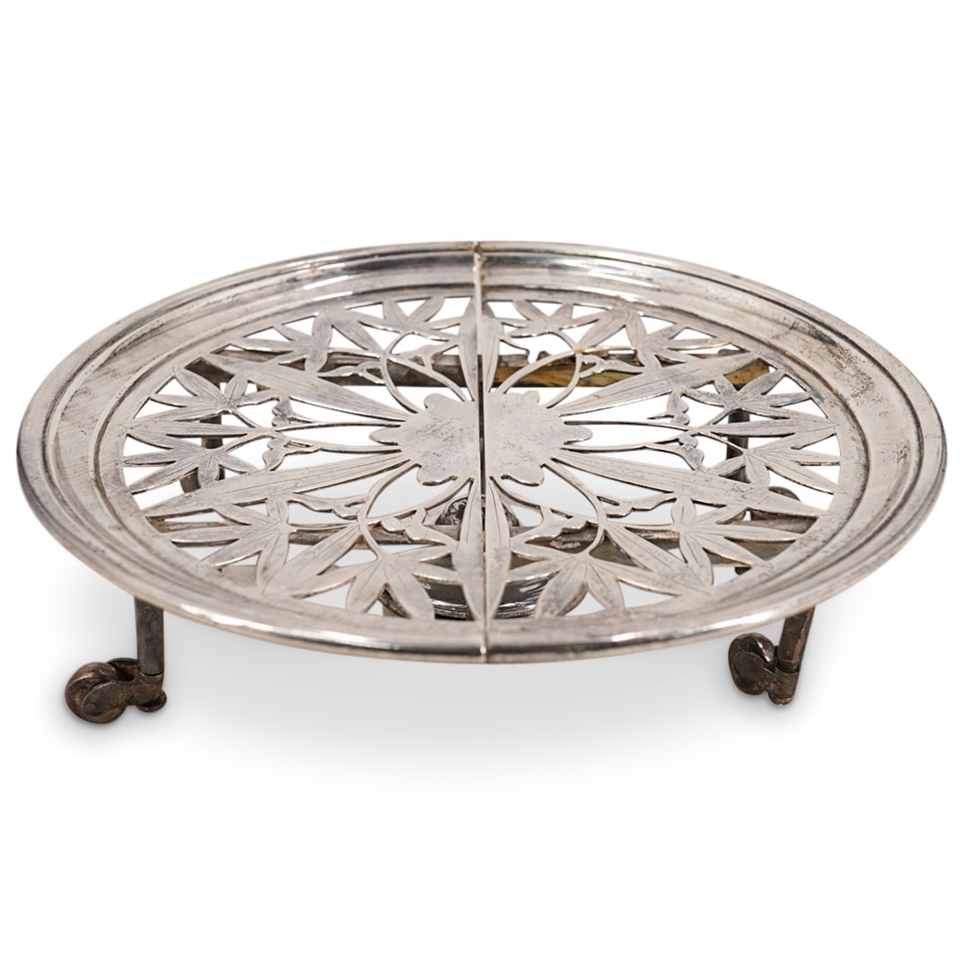 Antique Christofle Wheeled Silver Plated Burner: DESCRIPTION: Antique Christofle platter featuring a pierced well, wheels on its four feet, a burner, and a mechanism for widening the tray proper. CIRCA: Early 20th Century ORIGIN: France DIMENSIONS: