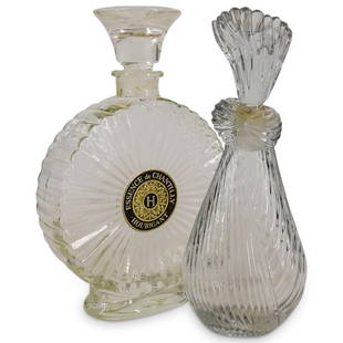 (2 Pc) Display Factice Perfume Bottles: DESCRIPTION: (2 Pc) Pair of display factice perfume bottles. Includes: (1 Pc) Mary McFadden glass perfume bottle (1 Pc) Vintage Houbigant "Essence de Chantilly" perfume bottle CIRCA: 20th Century ORIG