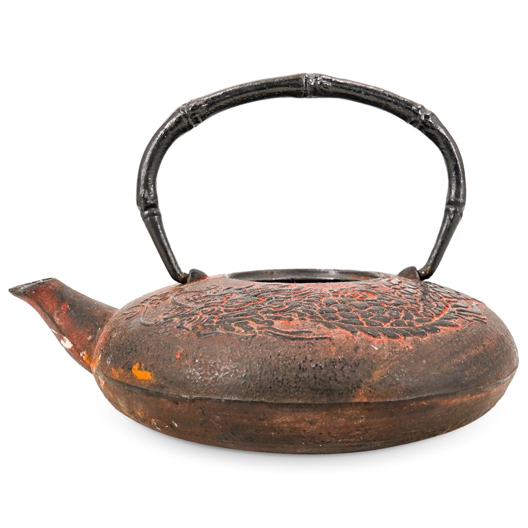 Vintage Chinese Iron Dragon Teapot: DESCRIPTION: Vintage iron teapot composed of a round body featuring a dragon design in low relief and sporting a bamboo form handle. Marked on underside in Han characters. CIRCA: Mid-20th Century ORIG
