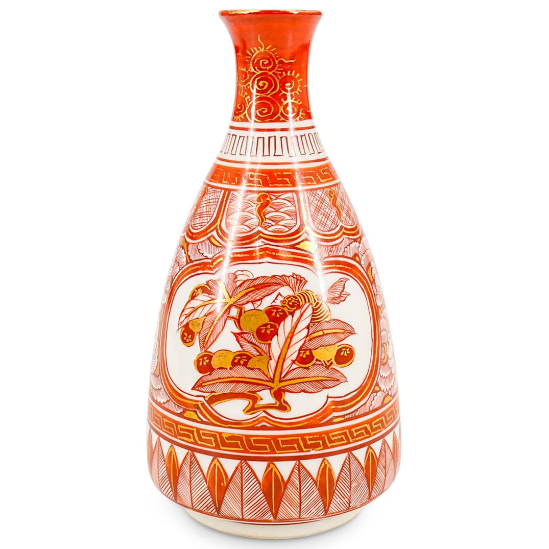Antique Japanese Kutani Porcelain Bud Vase: DESCRIPTION: Antique Kutani porcelain bud vase crafted with a narrow neck and featuring foliage motifs surrounded by floral, wave, and geometric patterns and motifs. Marked in kanji on underside. CIRC