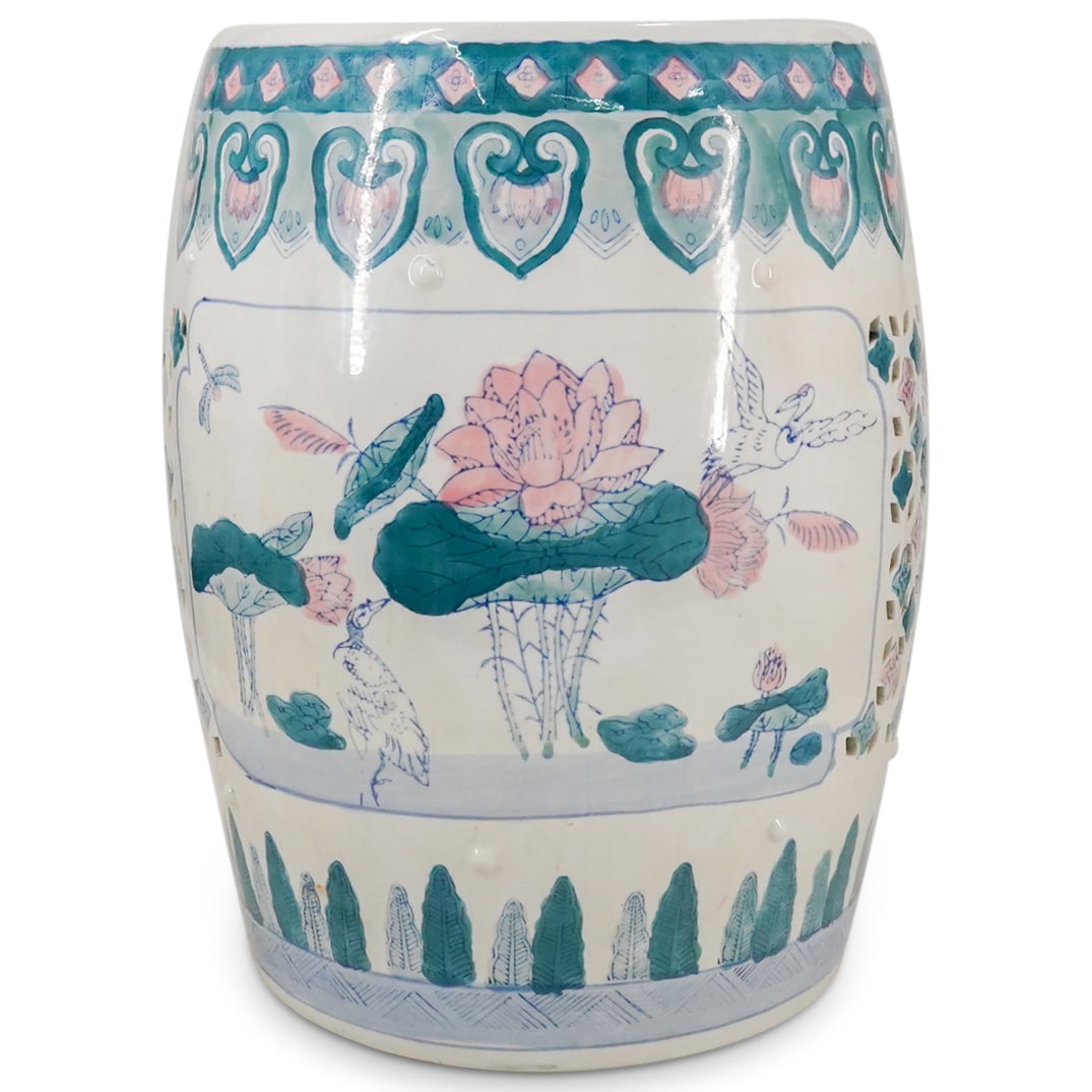 Chinese Porcelain Garden Stool: DESCRIPTION: Chinese glazed porcelain garden stool in white porcelain with a polychrome floral decorative motif depicting flowers, trees and birds motifs. The decorations are hand painted in a pastel
