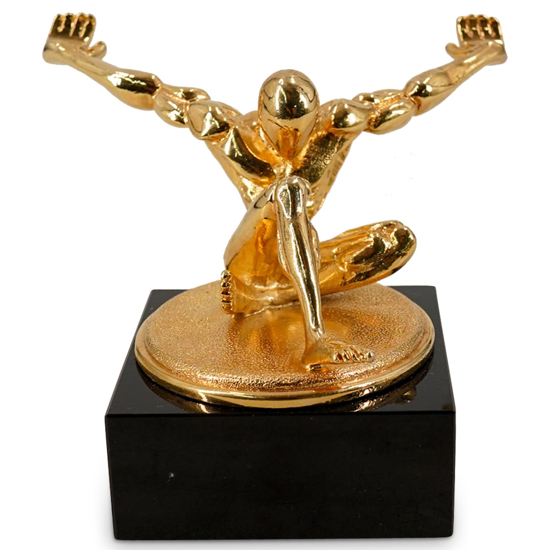 Jan Zagoory Designs 'Atlas' Gold-Hued Pen Holder: DESCRIPTION: Jac Zagoory Designs 'Atlas' gold hued figurative pen holder. This is the full-size version of the Atlas pen holder and will fit all regular-sized writing instruments. On a square black ba