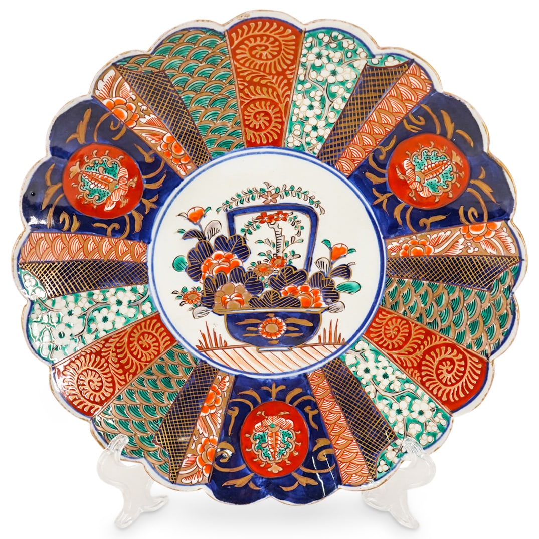 Japanese Imari charger: DESCRIPTION: Japanese Imari charger with a central medallion, which depicts a basket of flowers, surrounded by florals, the central medallion is also surrounded by a fan pattern of different colors an