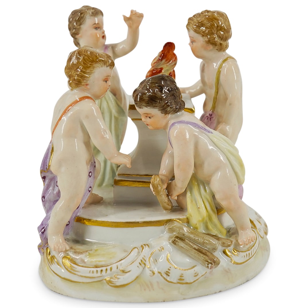 Antique Meissen Porcelain Putto Altar Grouping: DESCRIPTION: Antique Meissen porcelain sculpture depicting four puttos around a blazing altar. Base features gilt foliage accents and is hallmarked on underside. CIRCA: 19th to early 20th Century ORIG