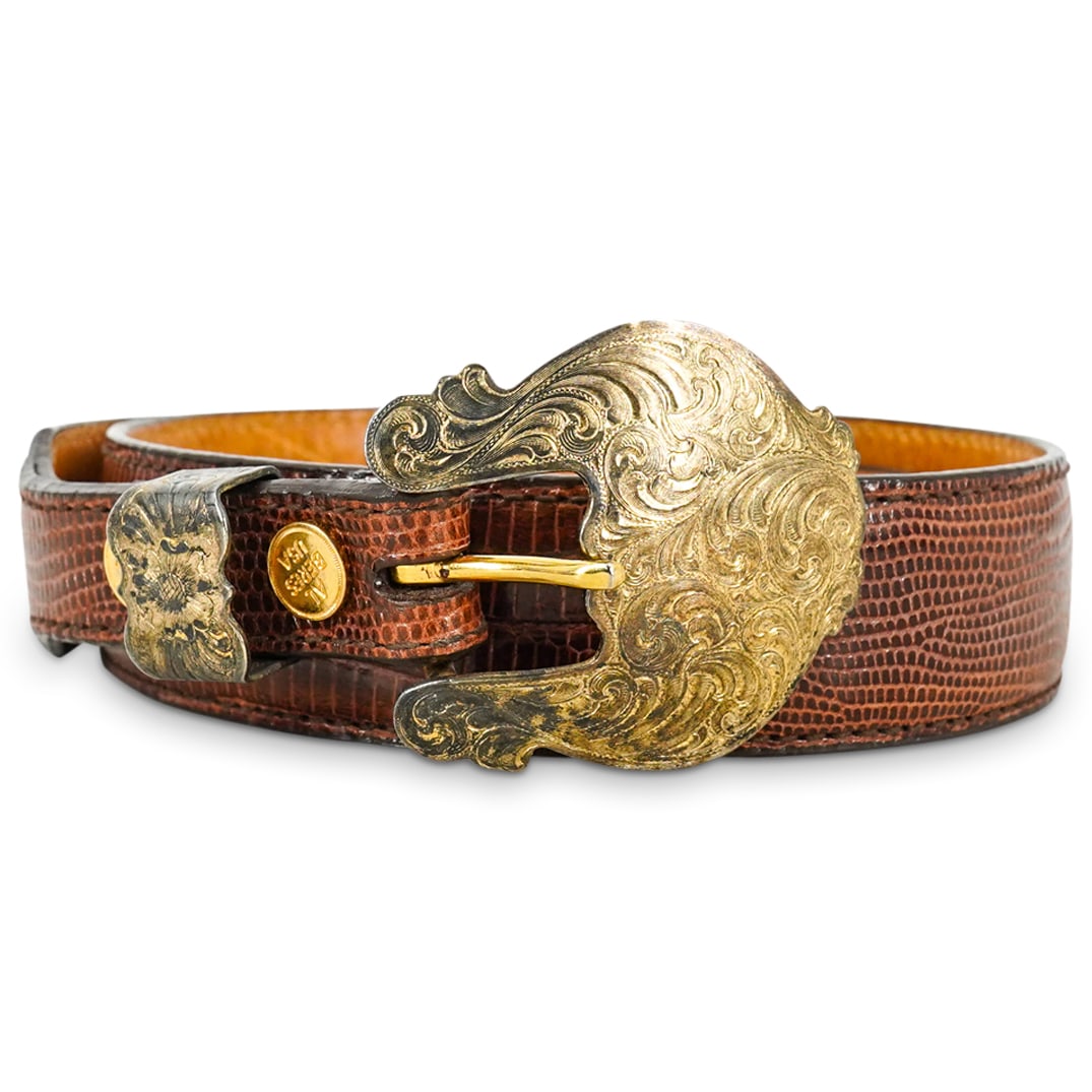 Vintage Al Beres Sterling Silver Buckle Brown Lizard Leather Belt: DESCRIPTION: Genuine Al Beres lizard leather belt, in natural brown leather, with ornate vermeil sterling silver buckle with etched decorative patterns. Marked "Al Beres USA". Size 28. CIRCA: 20th Cen