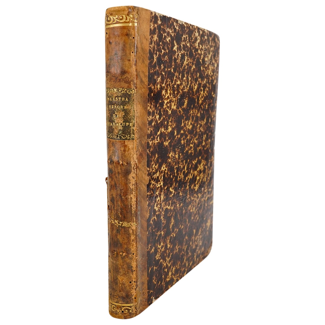 18th Century Spanish Nuestra Senora De Guadalupe History Volume: DESCRIPTION: Antique volume of Historia universal de la primitiva y milagrosa imagen de Nuestra Señora de Guadalupe containing the text in Spanish including various prefaces and poems and a full doub
