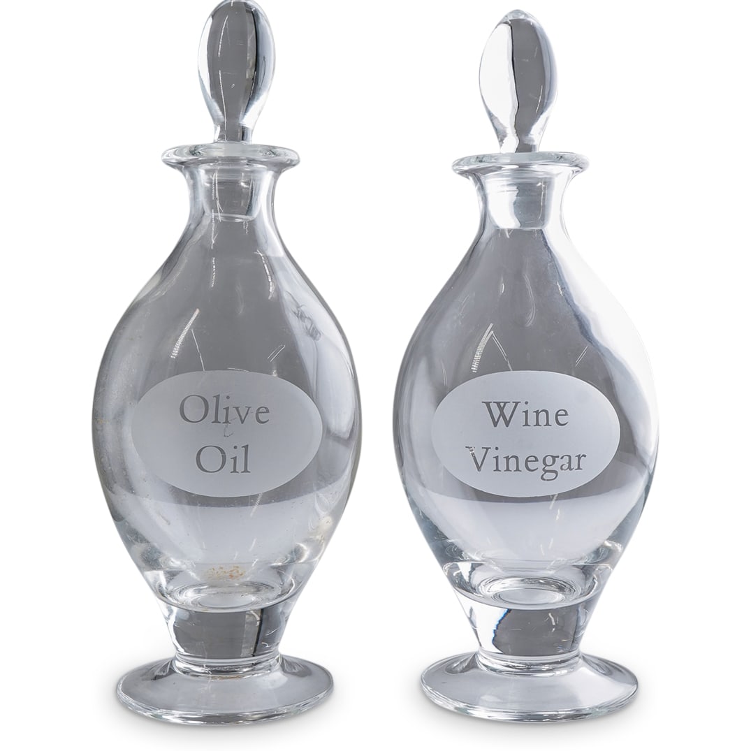 (2 Pc) William Yeoward crystal Oil & Vinegar Cruet Bottles Set: DESCRIPTION: (2 Pc) William Yeoward crystal Oil & Vinegar cruet bottles set, in clear crystal with "Olive Oil" and "Wine Vinegar" inscriptions. Marked with William Yeoward hallmark on the underside. C