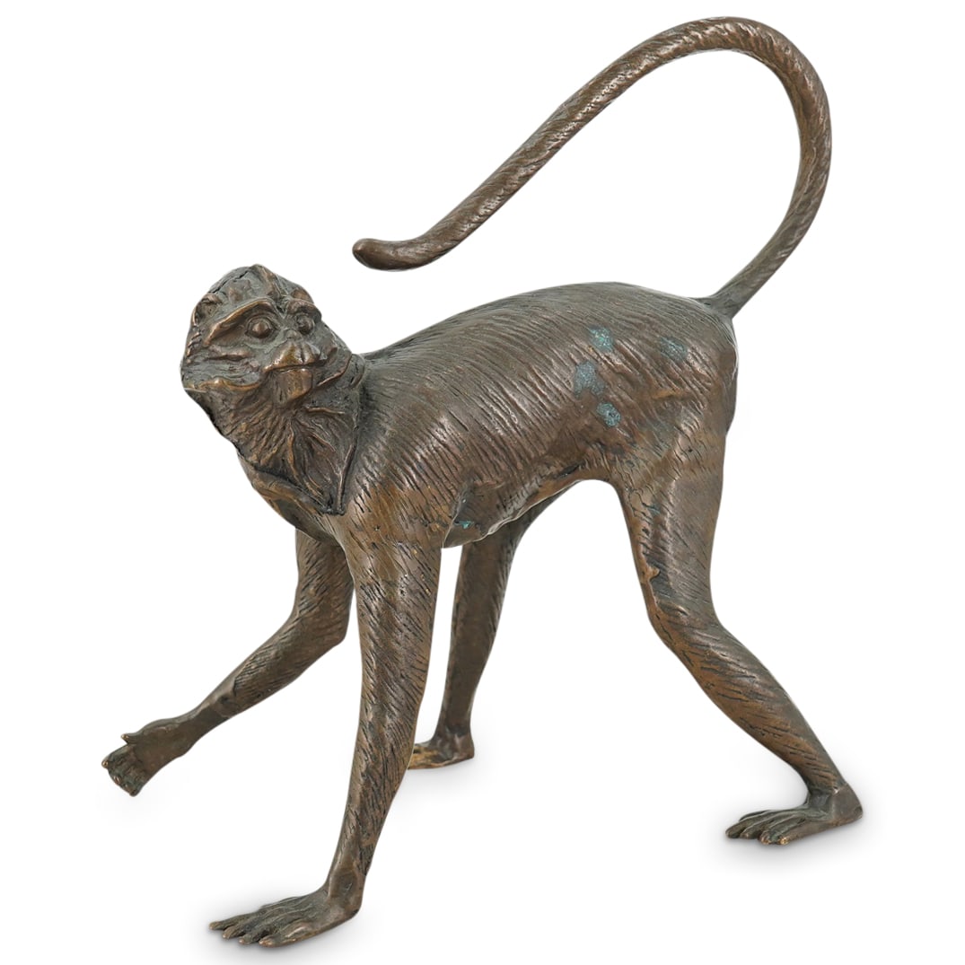 Vintage Bronze Long-Tailed Walking Macaque Monkey Sculpture: DESCRIPTION: Vintage bronze animal sculpture depicting a long-tailed walking macaque monkey, designed with etched texture depicting naturalistic details, with a detailed body surface and well-defined 