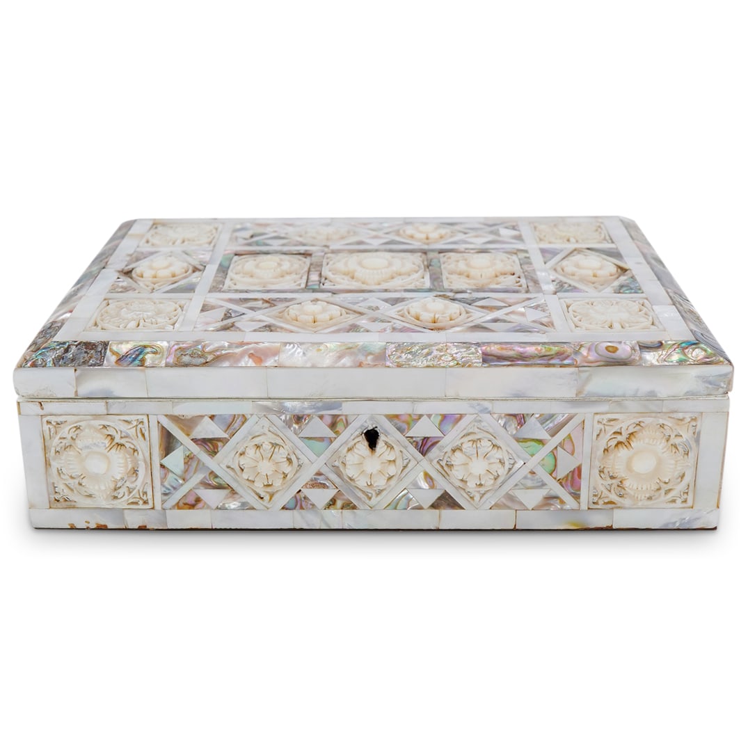 Mother of Pearl Jewelry Box: DESCRIPTION: Mother of Pearl jewelry box, (4) sides and top finished with carved and pierced MOP with a red velvet interior lining and wood bottom, with lock. CIRCA: 20th century. ORIGIN: Unknown DIME