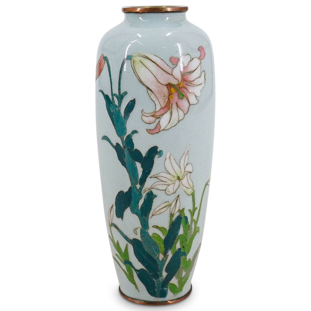 Japanese Cloisonne Miniature Vase: DESCRIPTION: Japanese cloisonne miniature vase decorated with flowers on a light teal/blue ground. CIRCA: Meiji period, 1868-1912. ORIGIN: Japan DIMENSIONS: H: 4.75" D: 2" CONDITION: Good condition. U