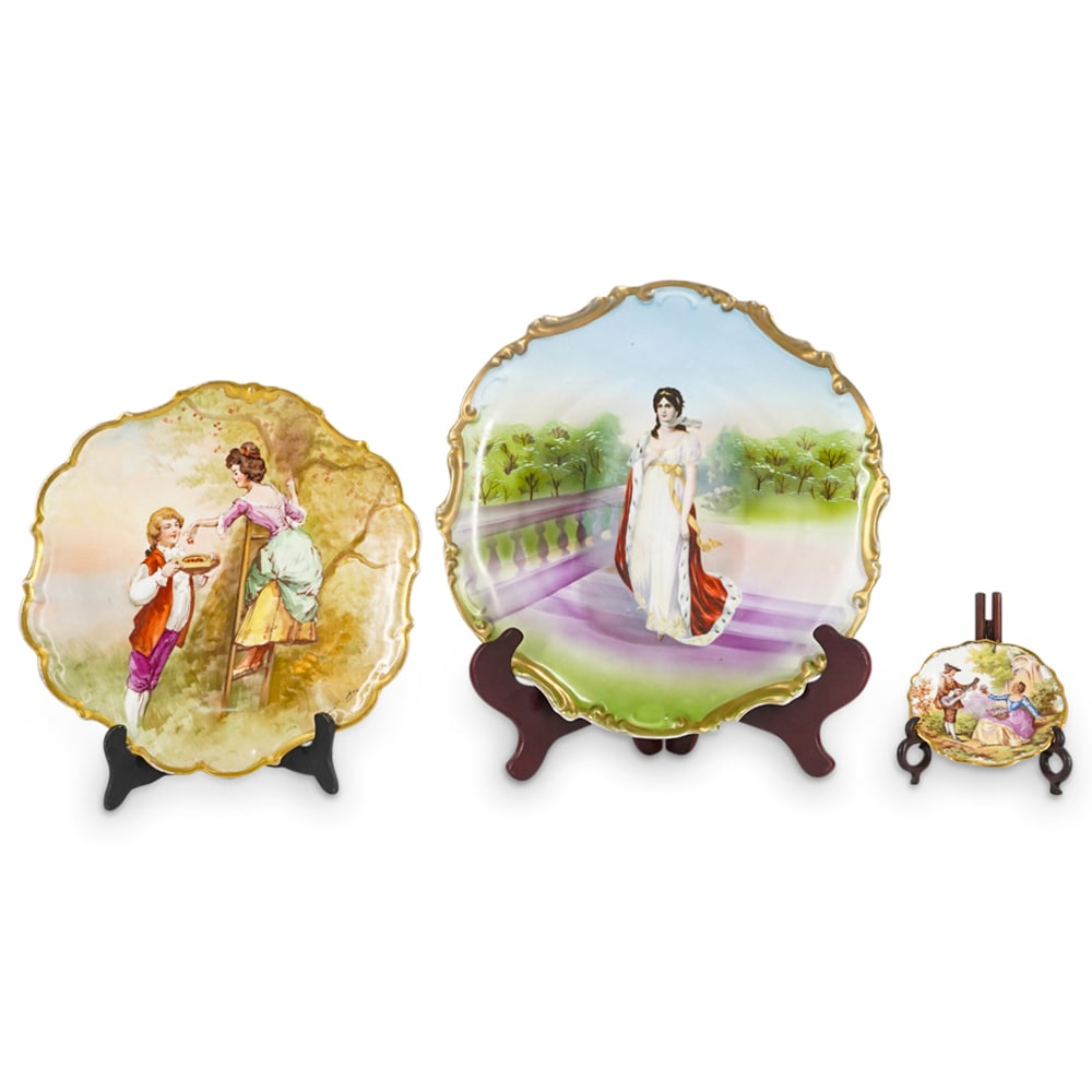 (3 Pc) Antique Limoges Porcelain Plates Grouping Set: DESCRIPTION: (3 Pc) Antique Limoges porcelain plates grouping set. Includes: (1) one Limoges antique LDBC hand painted cabinet plate depicting a garden scene with a young female figure picking up frui